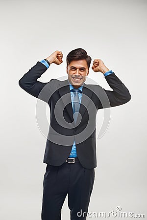 Business Man Celebrating Success against White Background Stock Photo