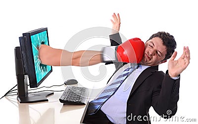 Business Man with computer hit by boxing glove Stock Photo