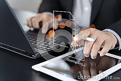 Business man downloading computer files or installing software on laptop computer, cloud storage technology Stock Photo