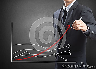 Business man drawing growth chart Stock Photo