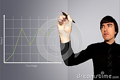 Business Man Draws Graph of Rising Stock Profits Stock Photo