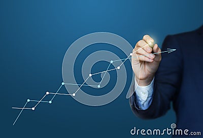 Business man draws a profit chart Stock Photo