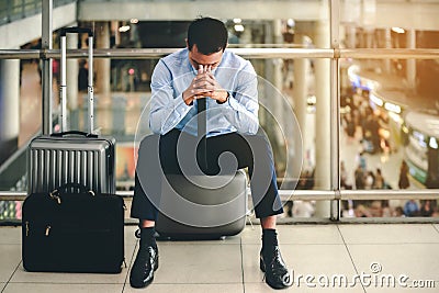 Business man failed to feeling hopeless, distraught, sad and discouraged in life. Concept there are mistakes in travel and Stock Photo