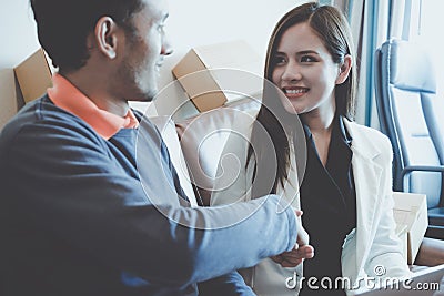 Business man gladly smile shaking hand with female partner Stock Photo