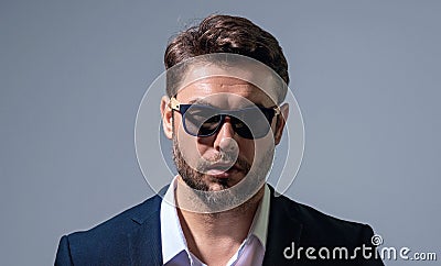 Business man on gray isolated banner background. Studio portrait of confident middle aged hiapanic businessman. Stock Photo