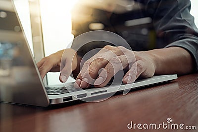 Business man hand working on laptop computer Stock Photo