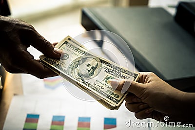 Business man hands handing money over business meeting Stock Photo