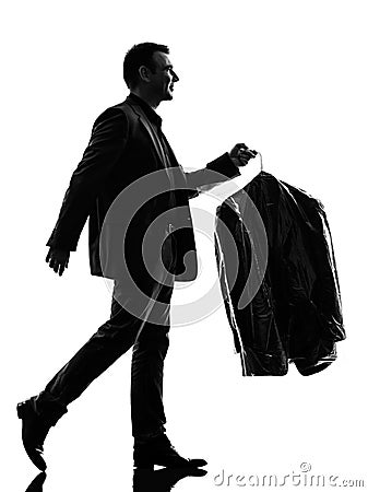 Business man holding dry clean clothes silhouette Stock Photo