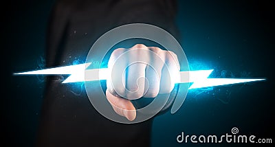 Business man holding glowing lightning bolt in his hands Stock Photo