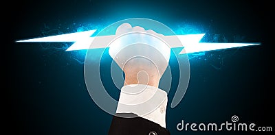 Business man holding glowing lightning bolt in his hands Stock Photo