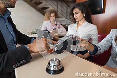 Business Man Hotel Pay For Room With Credit Card Woman Receptionist Registration At Reception Stock Photo