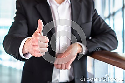 Business man or lawyer giving thumbs up. Stock Photo