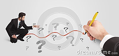 Business man looking at question marks and solution path Stock Photo