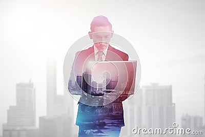 Business man with multiple exposure holding tablet computer Stock Photo