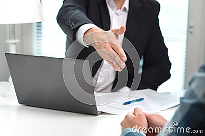 Business man offer and give hand for handshake in office. Stock Photo