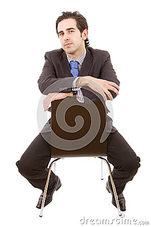 Business man portrait sitting on a chair Stock Photo