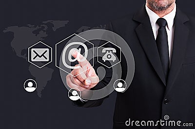 Business man pressing contact us using email digital button Stock Photo