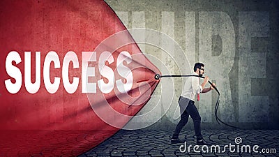 Business man pulling a red banner with success word overcoming a failure Stock Photo