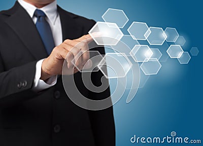 Business man push a hexagonal touch screen button Stock Photo