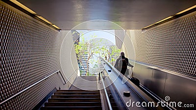 Business man raising stairs to reach the city Editorial Stock Photo