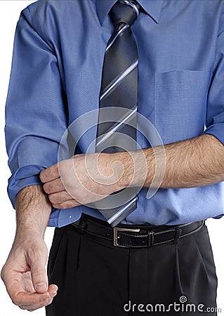 Business man rolling up his sleeves Stock Photo