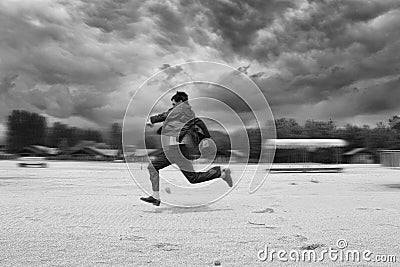 Business man runing in the beach. Motion blur Stock Photo