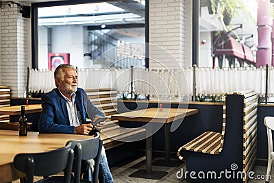 Business Man Senior Using Device Concept Stock Photo