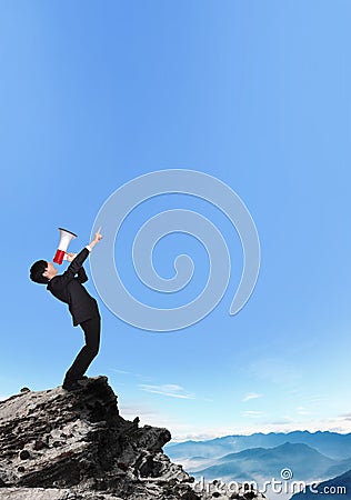 Business man shouting into a megaphone Stock Photo