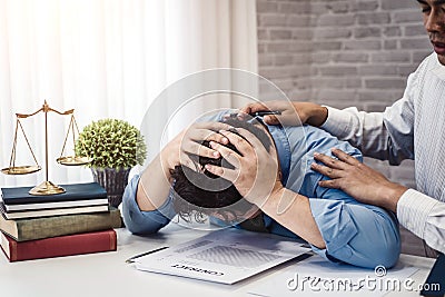 Business man sit strain serious for problem of contract insurance with lawyers consolation to solution the issue in office. Stock Photo