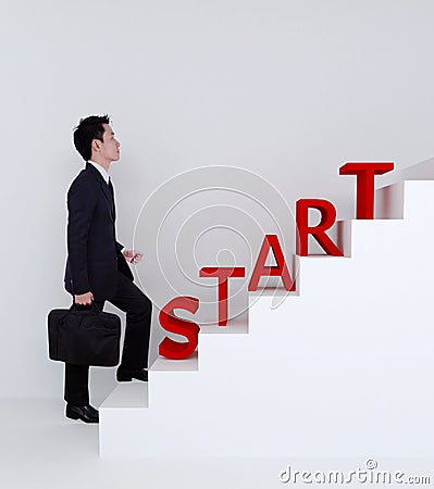 Business man start stepping up on stairs to success Stock Photo