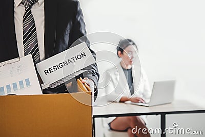 Business man stressing with resignation letter for quit a job packing the box and leaving the office , Resignation concept Stock Photo