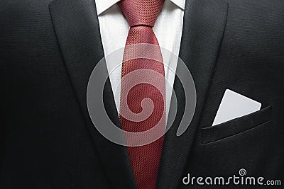 Business man in suit with ace in the pocket of his jacket. Metaphor to confidence in winning. Businessman ready for risk and deve Stock Photo