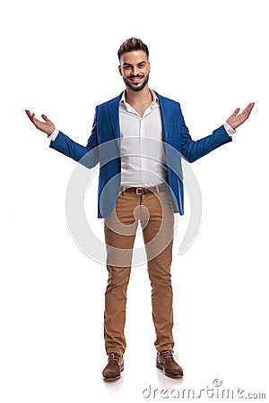 Business man in suit standing and greeting with arms opened Stock Photo