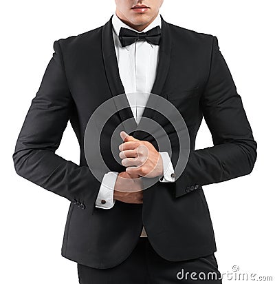 Business man in a suit straightens his jacket Stock Photo