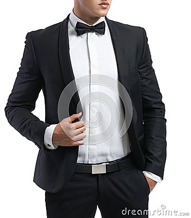 Business man in a suit straightens his jacket Stock Photo
