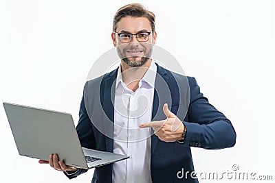 Business man in suit working on laptop in studio. Man checking email on laptop, writing message in social network, using Stock Photo