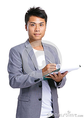 Business man take note on clipboard Stock Photo