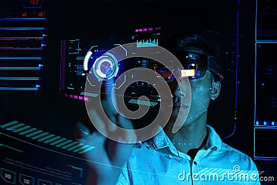 Business man try vr glasses hololens in the dark room | Young asian boy experience ar | Future technology concept Stock Photo