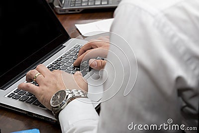 Business man using laptop close-up hands in Stock Photo