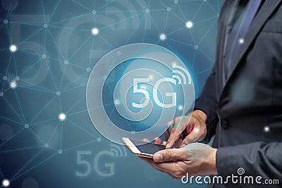 Business man using mobile phone with 5g network wireless technology to connect every communication ,iot internet of things Stock Photo