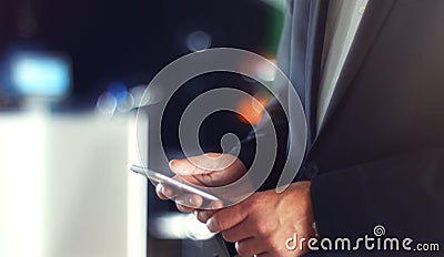 Business Man using Mobile Phone in Office Stock Photo