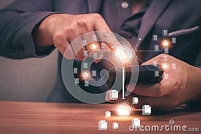 Business man using phone to upload and back up cloud computing in hand cloud technology data storage Stock Photo