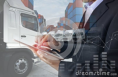 Business man is using tablet to calculate financial with Transport business logistics Stock Photo