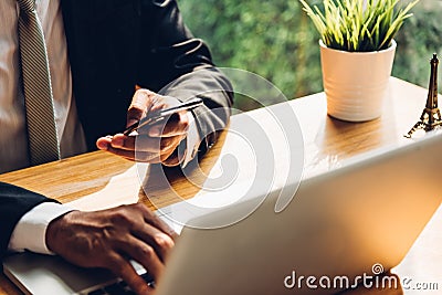 Business man using technology mobile smart phone with laptop com Stock Photo