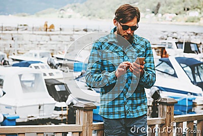 Business Man at vacations rent a yacht by smartphone Lifestyle success technology Stock Photo