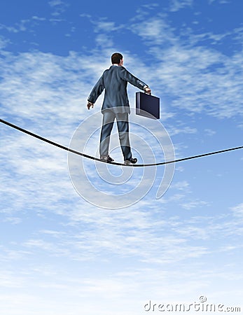 Business man Walking A Tightrope Stock Photo