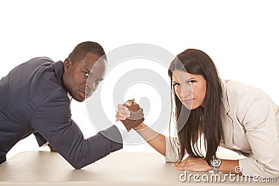 Business man and woman arm wrestle serious looking Stock Photo