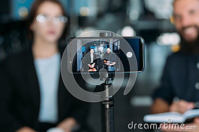 Business man woman video phone coaching workshop Stock Photo