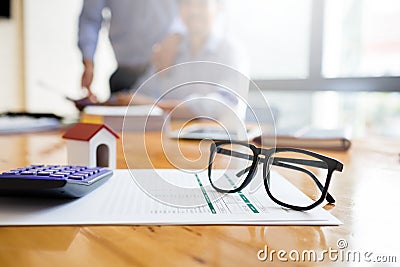 Business man working desk with financial paperwork data loan agreement with financial institution To buy real estate that is sold Stock Photo
