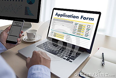 business man working on laptop computer use Online Web Job Application Form moniter Stock Photo